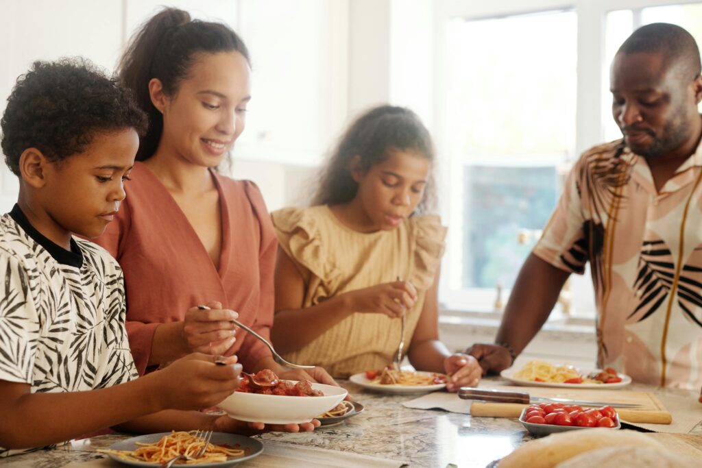 A sincere family sharing a meal at home, emphasizing love and togetherness.